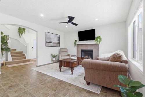 107 Cimarron Grove Circle, Okotoks, AB - Indoor Photo Showing Living Room With Fireplace