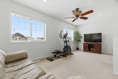 107 Cimarron Grove Circle, Okotoks, AB - Indoor Photo Showing Gym Room