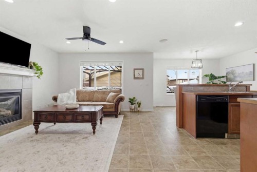 107 Cimarron Grove Circle, Okotoks, AB - Indoor Photo Showing Other Room With Fireplace