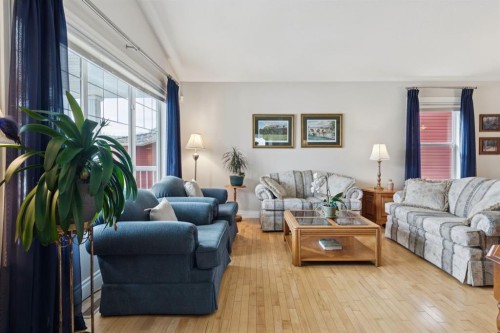 657 Woodside Court Nw, Airdrie, AB - Indoor Photo Showing Living Room