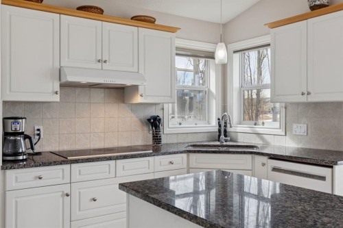 657 Woodside Court Nw, Airdrie, AB - Indoor Photo Showing Kitchen With Upgraded Kitchen