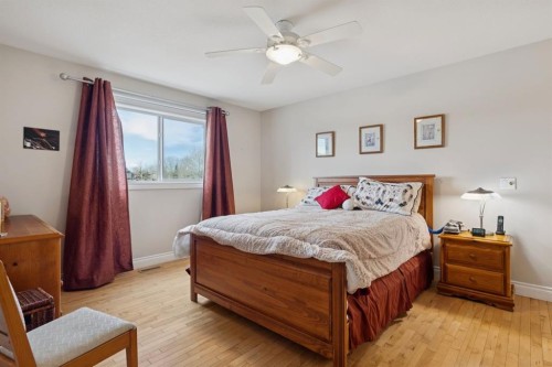 657 Woodside Court Nw, Airdrie, AB - Indoor Photo Showing Bedroom