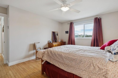 657 Woodside Court Nw, Airdrie, AB - Indoor Photo Showing Bedroom