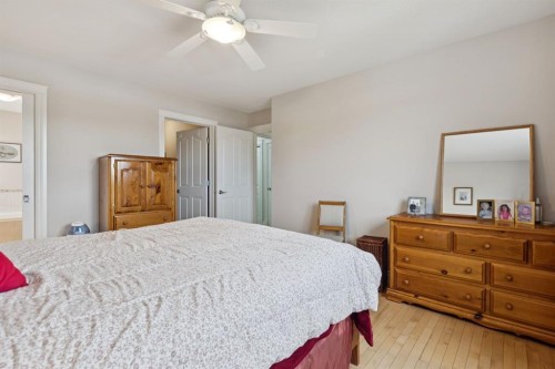 657 Woodside Court Nw, Airdrie, AB - Indoor Photo Showing Bedroom
