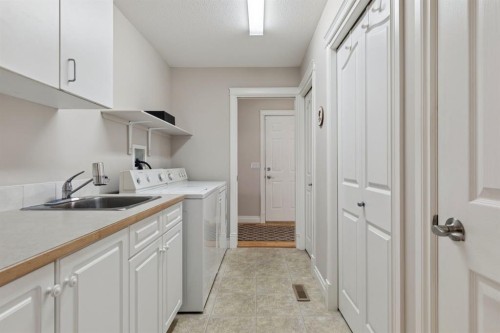 657 Woodside Court Nw, Airdrie, AB - Indoor Photo Showing Laundry Room