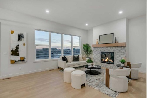 341 Limestone Bay, Balzac, AB - Indoor Photo Showing Living Room With Fireplace