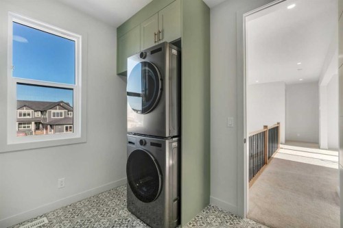 341 Limestone Bay, Balzac, AB - Indoor Photo Showing Laundry Room
