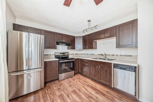 24 Abergale Way Ne, Calgary, AB - Indoor Photo Showing Kitchen With Double Sink