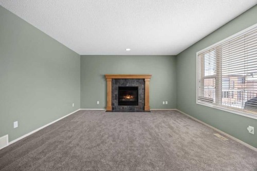19 Sienna Park Crescent Sw, Calgary, AB - Indoor Photo Showing Living Room With Fireplace