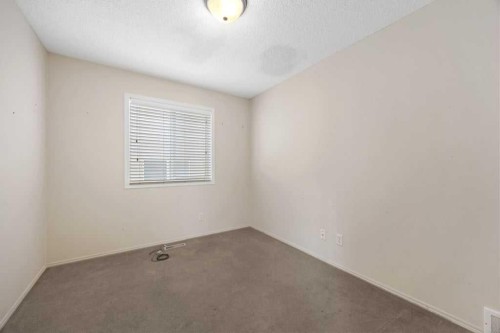 19 Sienna Park Crescent Sw, Calgary, AB - Indoor Photo Showing Other Room