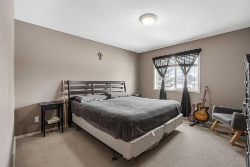19 Sienna Park Crescent Sw, Calgary, AB - Indoor Photo Showing Bedroom