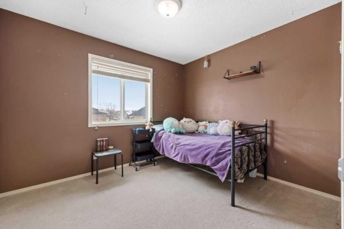19 Sienna Park Crescent Sw, Calgary, AB - Indoor Photo Showing Bedroom