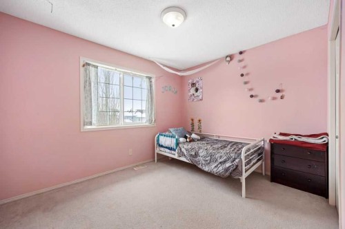 19 Sienna Park Crescent Sw, Calgary, AB - Indoor Photo Showing Bedroom