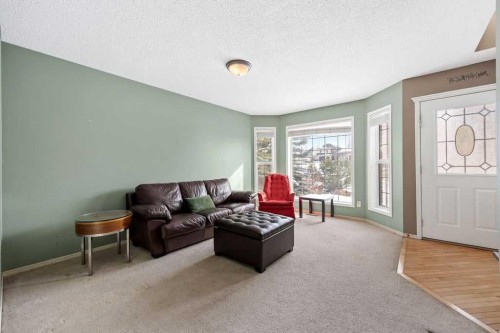 19 Sienna Park Crescent Sw, Calgary, AB - Indoor Photo Showing Living Room