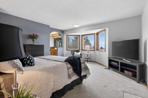 677 Hawkwood Boulevard Nw, Calgary, AB - Indoor Photo Showing Bedroom