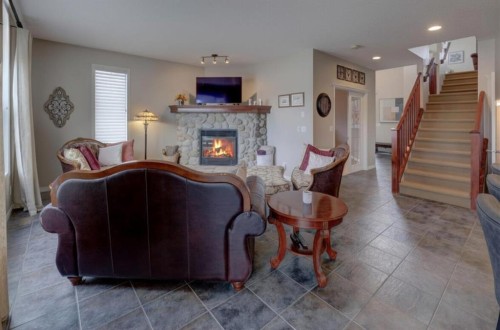110 Royal Oak View Nw, Calgary, AB - Indoor Photo Showing Living Room With Fireplace