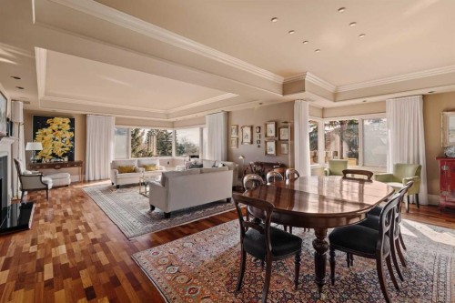 3S-222 Eagle Ridge Drive Sw, Calgary, AB - Indoor Photo Showing Dining Room With Fireplace