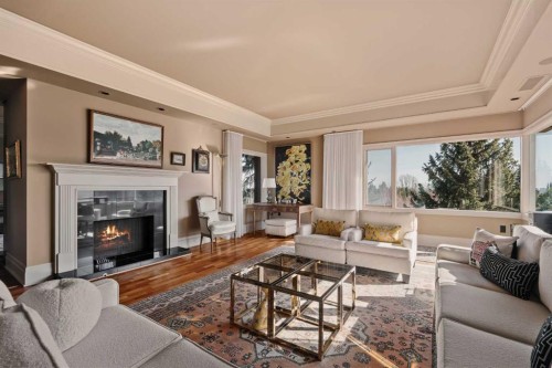 3S-222 Eagle Ridge Drive Sw, Calgary, AB - Indoor Photo Showing Living Room With Fireplace