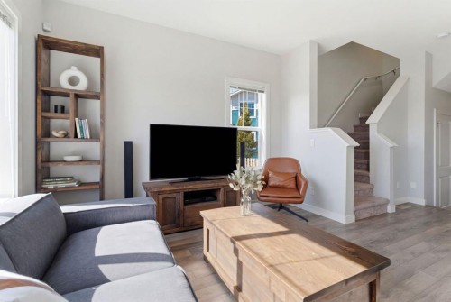 1208 Jumping Pound Common, Cochrane, AB - Indoor Photo Showing Living Room