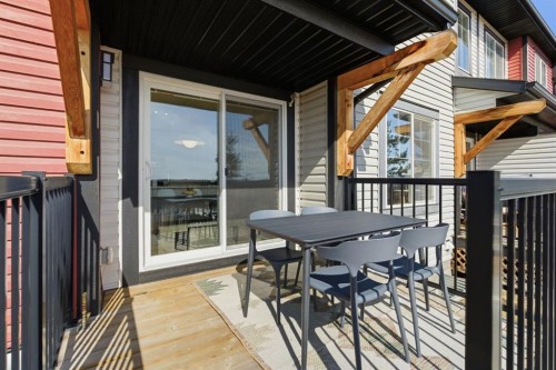 1208 Jumping Pound Common, Cochrane, AB - Outdoor With Deck Patio Veranda With Exterior