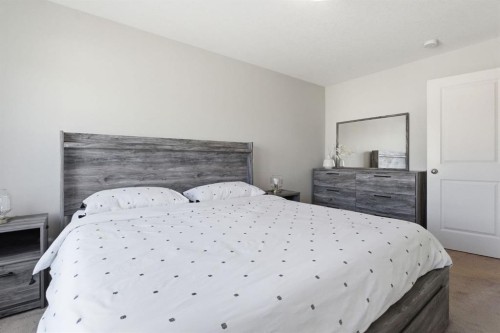 1208 Jumping Pound Common, Cochrane, AB - Indoor Photo Showing Bedroom