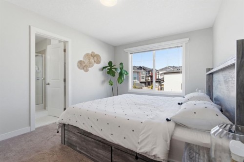 1208 Jumping Pound Common, Cochrane, AB - Indoor Photo Showing Bedroom