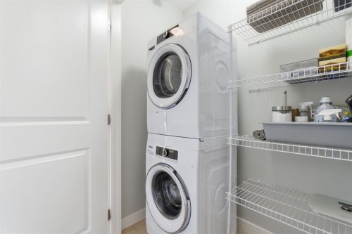 1208 Jumping Pound Common, Cochrane, AB - Indoor Photo Showing Laundry Room