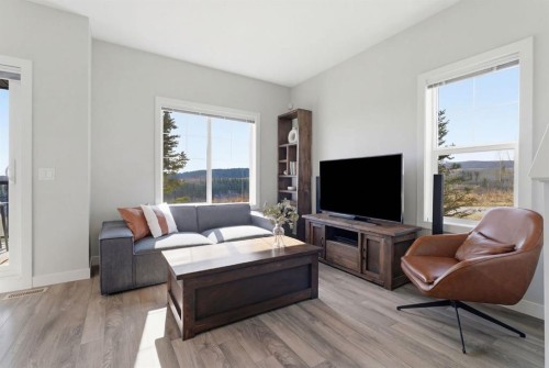 1208 Jumping Pound Common, Cochrane, AB - Indoor Photo Showing Living Room
