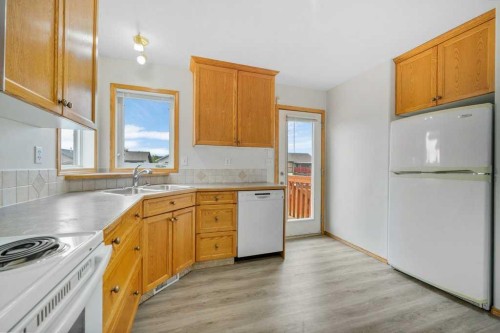 22 Lanterman Close, Red Deer, AB - Indoor Photo Showing Kitchen With Double Sink