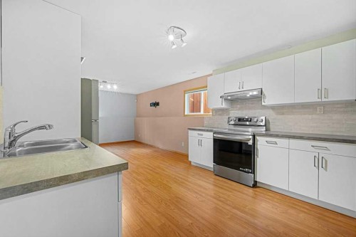 22 Lanterman Close, Red Deer, AB - Indoor Photo Showing Kitchen With Double Sink