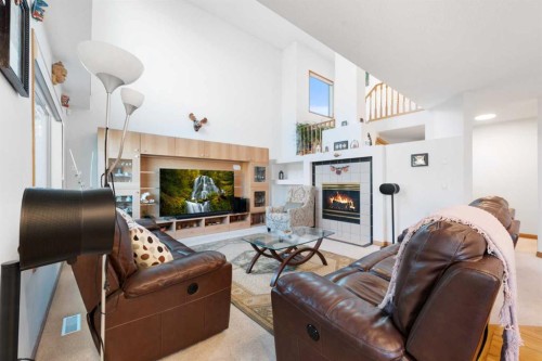 43 Edgebrook Cove Nw, Calgary, AB - Indoor Photo Showing Living Room With Fireplace