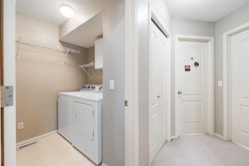 69 Hampstead Gardens Nw, Calgary, AB - Indoor Photo Showing Laundry Room