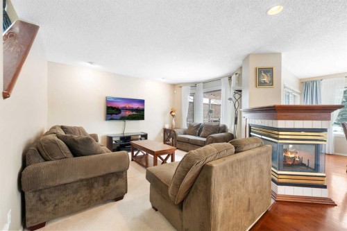 69 Hampstead Gardens Nw, Calgary, AB - Indoor Photo Showing Living Room With Fireplace