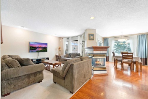 69 Hampstead Gardens Nw, Calgary, AB - Indoor Photo Showing Living Room With Fireplace