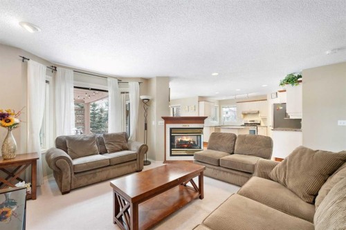 69 Hampstead Gardens Nw, Calgary, AB - Indoor Photo Showing Living Room With Fireplace