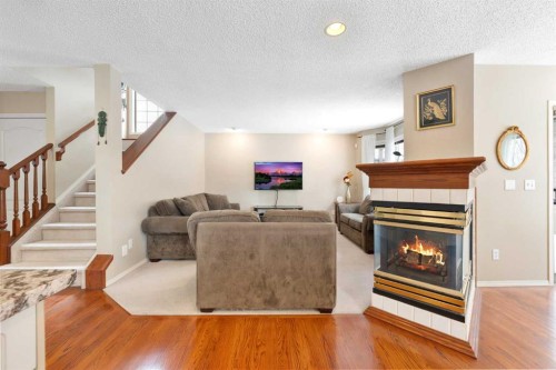 69 Hampstead Gardens Nw, Calgary, AB - Indoor Photo Showing Living Room With Fireplace
