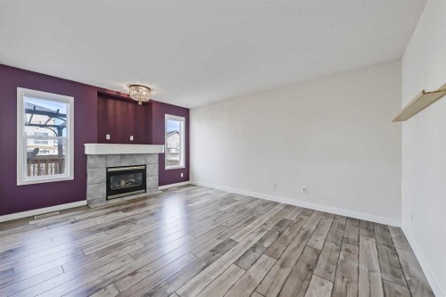123 Arbour Butte Road Nw, Calgary, AB - Indoor Photo Showing Other Room With Fireplace