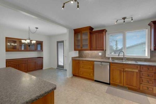 3 Madigan Court Ne, Calgary, AB - Indoor Photo Showing Kitchen With Double Sink
