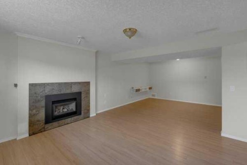 3 Madigan Court Ne, Calgary, AB - Indoor Photo Showing Living Room With Fireplace
