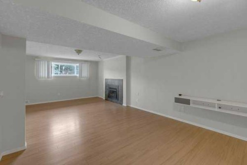 3 Madigan Court Ne, Calgary, AB - Indoor Photo Showing Other Room With Fireplace