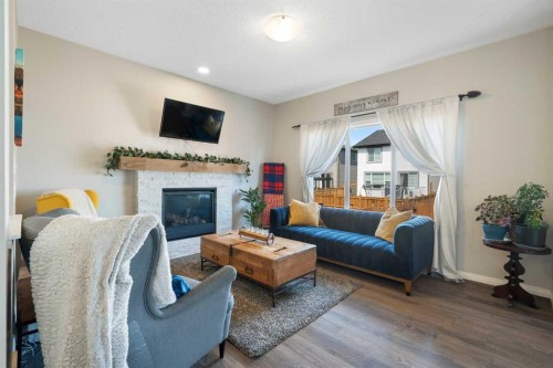 217 Buckskin Way, Cochrane, AB - Indoor Photo Showing Living Room With Fireplace