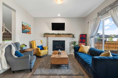 217 Buckskin Way, Cochrane, AB - Indoor Photo Showing Living Room With Fireplace