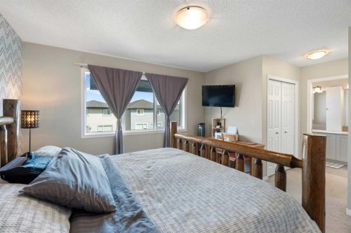 217 Buckskin Way, Cochrane, AB - Indoor Photo Showing Bedroom