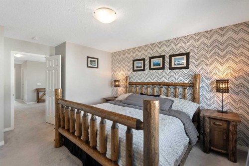 217 Buckskin Way, Cochrane, AB - Indoor Photo Showing Bedroom
