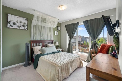 217 Buckskin Way, Cochrane, AB - Indoor Photo Showing Bedroom