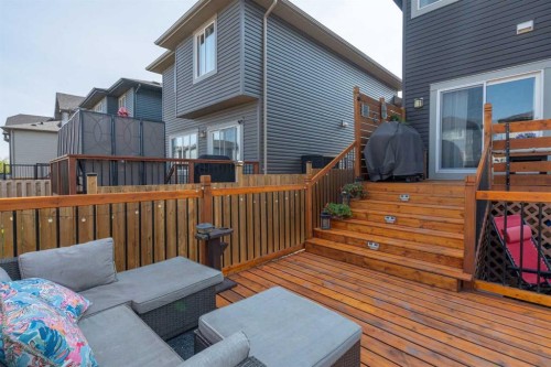 217 Buckskin Way, Cochrane, AB - Outdoor With Deck Patio Veranda With Exterior