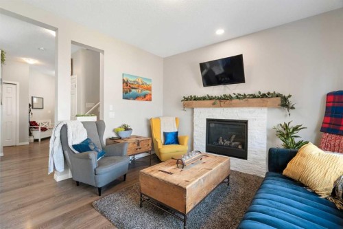 217 Buckskin Way, Cochrane, AB - Indoor Photo Showing Living Room With Fireplace