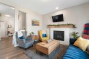 217 Buckskin Way, Cochrane, AB  - Indoor Photo Showing Living Room With Fireplace 