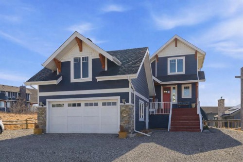 419 Cottageclub Cove, Rural Rocky View County, AB - Outdoor With Facade