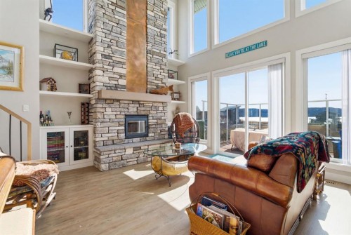 419 Cottageclub Cove, Rural Rocky View County, AB - Indoor Photo Showing Living Room With Fireplace